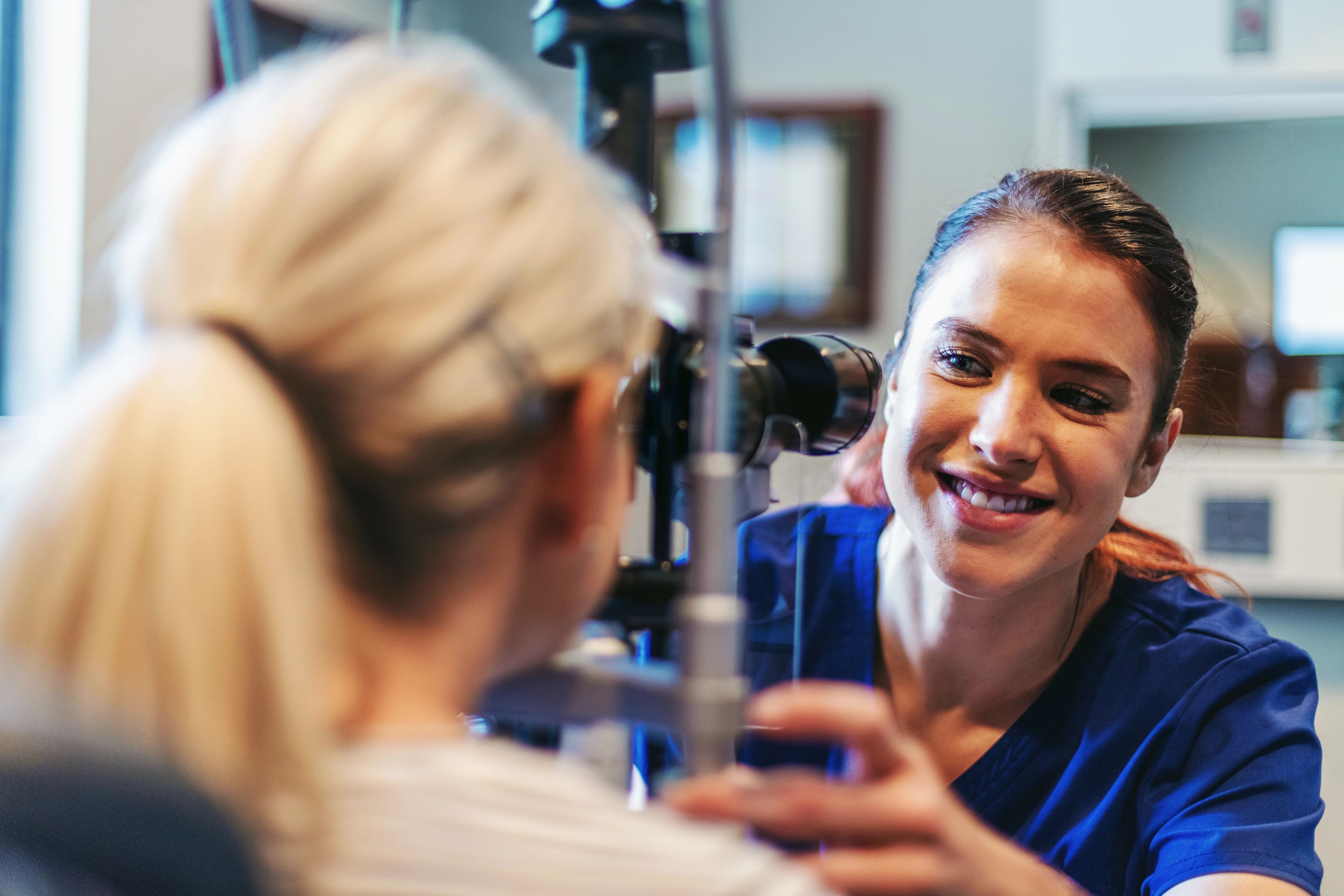 Doctor performing eye exam on patient