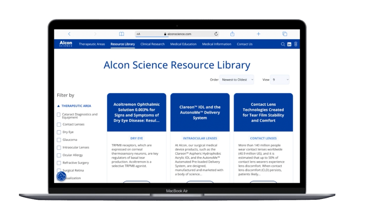 A photo of a laptop with the Alcon Science website open